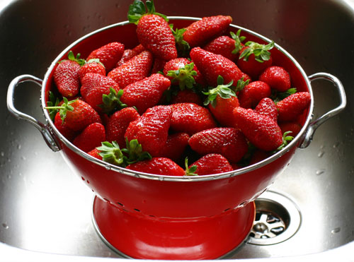 strawberry - this is a picture of strawberries. strawberries are small sweet red fruit containing many achenes resembling seeds. it may also refer to a plant that spreads by means of rooting stems and bears strawberries. it is very delicious. try some