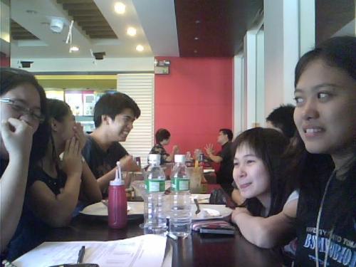 My friends and I - We were in a restaurant called 'Icecream House'.. We usually eat here for our get-together. So here, we eat, talk, joke around, and everything. We goof around, like what you see in this picture. That's me on the right, in black. Picture taken by my laptop. Lol