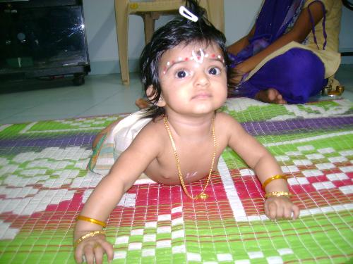 My Birthday gift  - Watch out my cute angel. She has been dressed up like lord krishna. I am so much love her. She stares for photos and smiles after the flash.