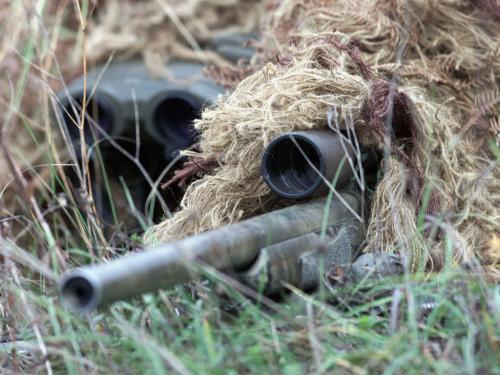 Sniper - Army sniper with rifle and sight.