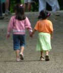 Friends -  A photo of two children holding hands as friends under Yahoo page.