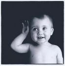A child with hand near ear. -  I chose a child with a hand near the ear for the subject of 'listener'.