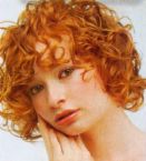 Red curly hair. -  I picked this picture to upload onto this subject of 'hair' as an interesting hair style of red and curly.
