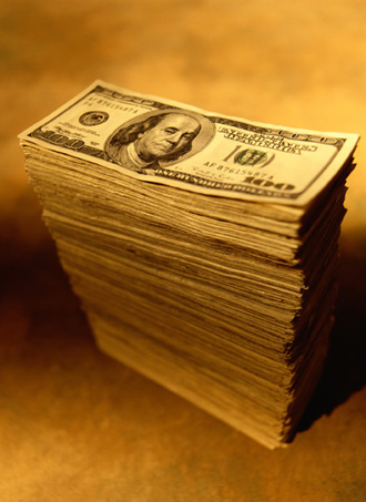 stack of money. - Some people will do anything for this amount of money.