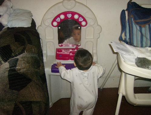 Who's that gorgeous boy in the mirror? - My son staring at himself in the mirror