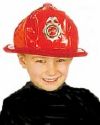 A boy in a fireman hat. -  A picture of a little boy in a fireman's hat.