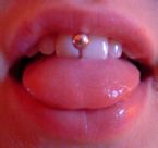 ouch! - tongue piercing. this must be hurt.