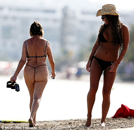 Woman in thong - This is a woman in a bikini thong swimsuit out enjoying the beach.