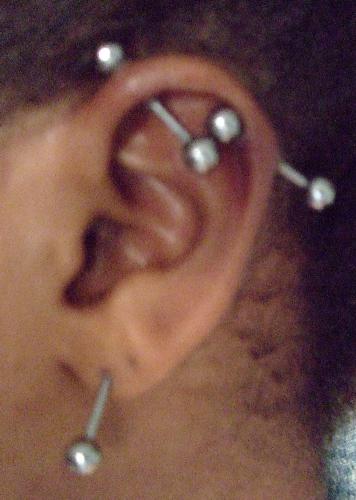 piercings - This is my industrial. I took out the one long ring and put in to small ones. cheeze!