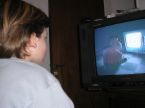 Boy watching television -  A photo of a young boy watching television.