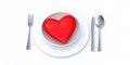 Heart-plate - Dinner setting with a red heart on the plate.