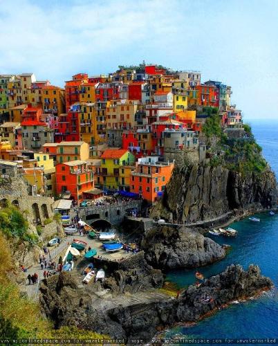 Strnage homes... - The colorful box shaped homes...Strangely stacked atop each other...and the most strangest if their proximity to a deep steep cliff..