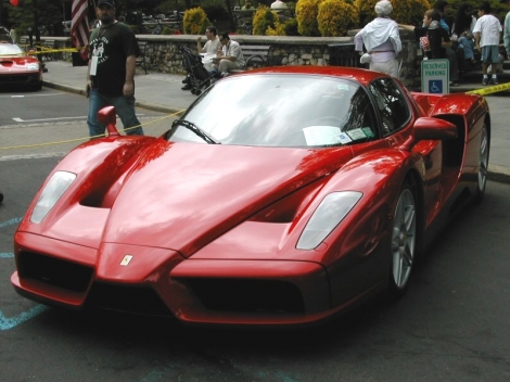 car - a ferrari enzo worth more then 1 million dollars and is the 3rd most expensive car to date. it was built in 2003 using formula one technology reaching a maximum speed of 301 kmh.