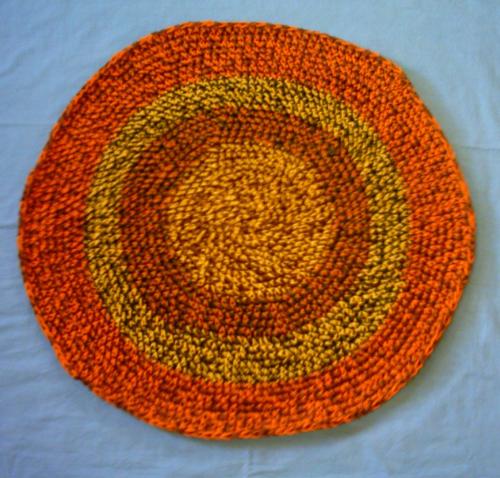 Orange 'rag' rug - I made this rag-style rug from leftover rug yarn.