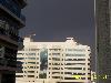 a bldg looking great during the rainy season - wonderful contrast of the desert where in the sunshine and the dark clouds are seen