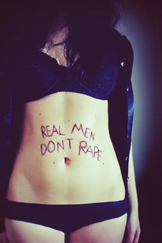 Real Men Don't rape - Picture of a girl in a her underclothes and REAL MEN DON'T RAPE. Across her stomach.
