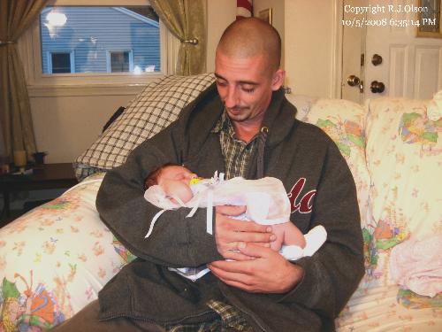 Nate and Savanna - Our son (28) with our new granddaughter, Savanna. This is not his baby, it is his sisters.