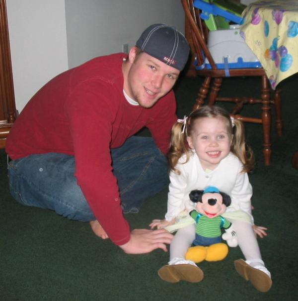 daughter and husband - This is my Husband, and my daughter. This was on easter of 2005. we were getting ready to go to his parents for easter dinner.