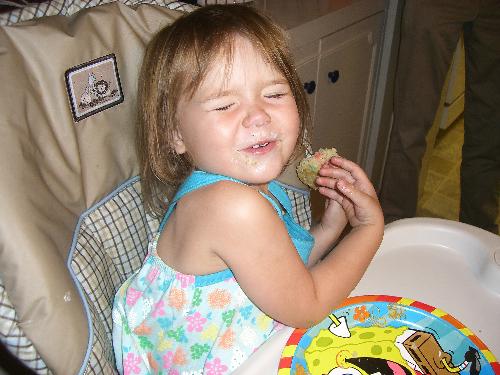 chloe - my daughter chloe at her 2nd birthday party. Hogging her cupcake all to herself.