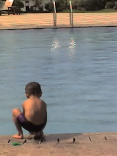 A Boy Near The Water - This picture was taken by me when I saw the whole picture in my eyes just by looking at the actual moment. It just comes out naturally. I just used a camera phone that time but it didn't matter because the subject was more relevant to me than anything else.