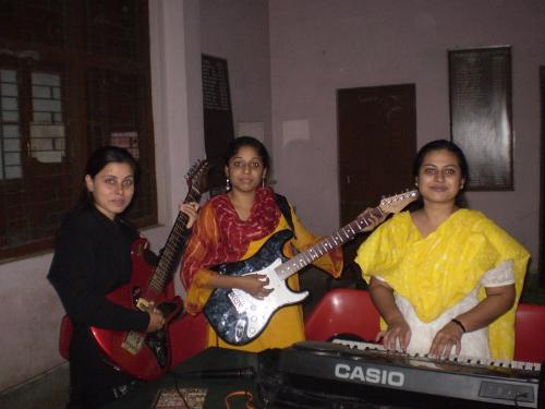 beautiful girl in company of three........... - my girl friend trying to learn music..