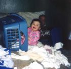 child getting into laundry - not my baby, but cute still!