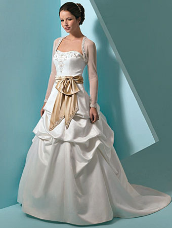 Romantic Wedding Gown - A romantic wedding gown generally reminds the viewer of a fairy tale wedding with the full skirt that is puffed out from the many yards of tulle beneath. This dress may comprise full sleeves at the shoulders with a fitted sleeve below the elbows.
