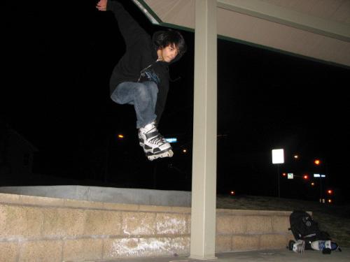 Skating - Son jumping walls while roller blading.