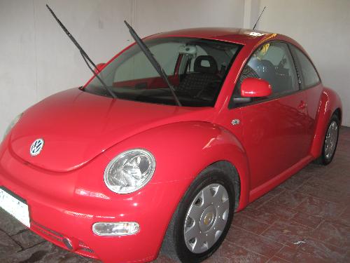 Car - Volks Wagen Color: red Model: Beetle convertible Year: 2000