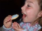 Child eating a cookie - A picture of a child ready to eat a cookie.
