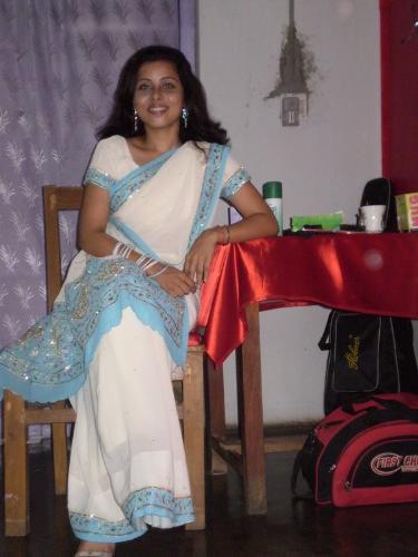 blue saree ... - the red shining object by her side....