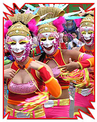 masskara festival - street dancers wearing colorful and beautiful mask while dancing on the street