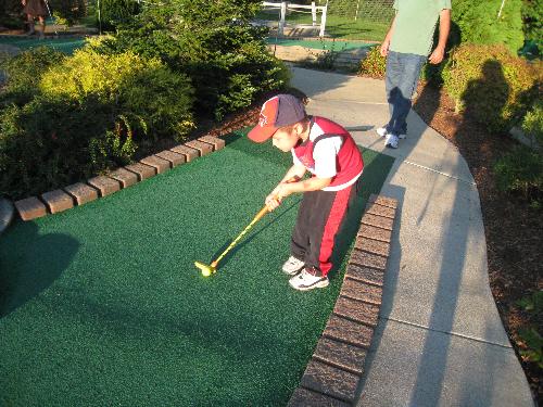 grandson Jr playing mini golf - Jr playing mini golf