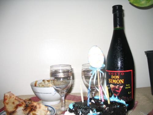 4th anniversary celebration - table for two. wine and cake for love and happiness.
