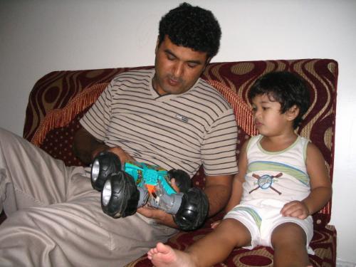 Father and Son - This is bonding time for Papa and Sami. My husband had just bought a remote control car for Sami and here he's teaching him the parts of a car before they start to play. Sami listens intently and seems so excited to play. This is actually a gift for both father and son so they can bond and play together. Papa loves his son so dearly and likes to teach him boy-things himself.