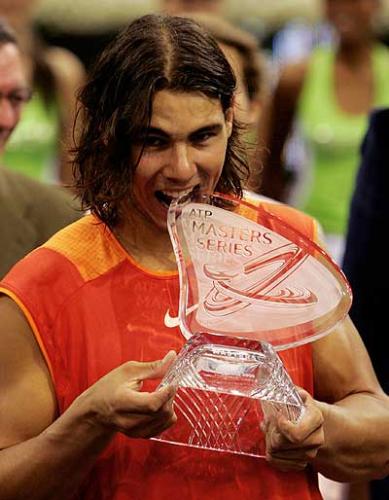 rafael nadal - He turned professional in 2001 at the age of 15 and won his first ATP match, defeating Ramon Delgado to become only the ninth player before his 16th birthday to do so.  His hero is Carlos Moya, his coach is his uncle, Toni Nadal and he is managed by Carlos Costa.