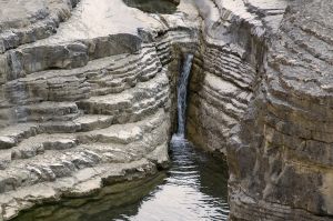 Falling water - A falling water body. In this photo water is falling from a huge rock.