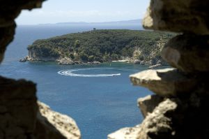 A view - A different view of water through a hole in a rock.