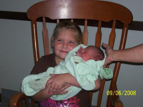 Mya & Kyle - This is Mya holding Kyle for the first time
