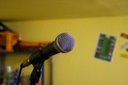 microphone - The microphone is very important in live music, where there are sorrounding sound and the level of volume should be higher.  A microphone amplify the sounds and it is used also for singing.