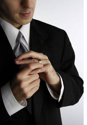 Unfaithful Husband - man removing wedding ring, being unfaithful