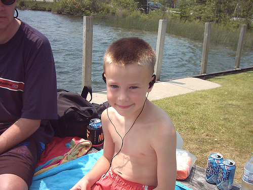 Kid's music - A kid listening while chilling.