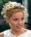 Blonde curly hair style - Woman in a curly hair style.