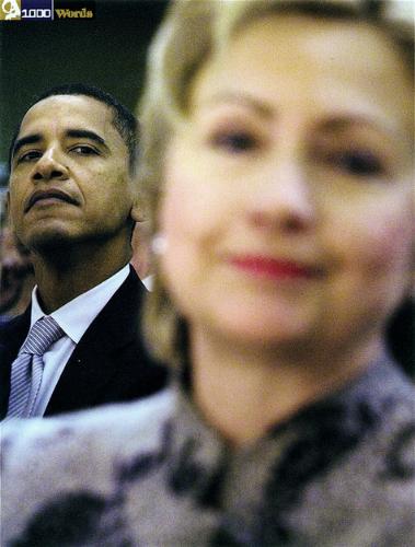 Hillary and Obama - Obama doing what he does naturally. Looking down his nose at people.