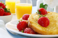 Breakfast - Simple healthy breakfast, with orange juice, buttered toast and strawberries
