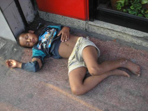Picture of Poverty - A poor child showing the proof of a hard life.