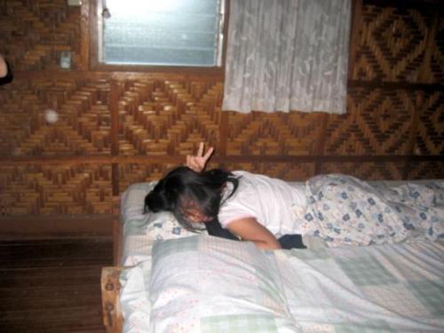 me - a sleepy head, my friends were trying to get me out of bed to do more schoolwork with them but i was too tired.