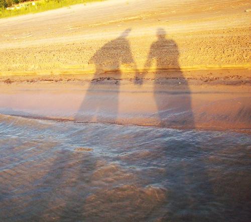 Romantic Sunset Photo of a Walk on the Beach - This was in Wasaga Beach, Ontario. It is the longest fresh water beach in the world at 14 km long which is 8.7 miles.