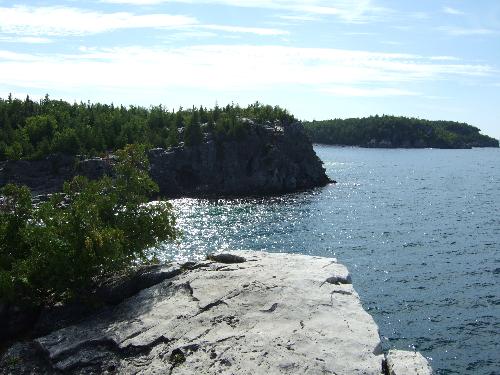 Cliff in Tobermory - Tobermory, Bruce Peninsulta, Ontario, Canada. Most beautiful cliffs around the area! Amazinf scenery, natural warm water grotto, perfect for swimming or jumping of cliffs in the summer. Hiking during the summer is great. It feels as if you are in the mountains. A 5 hour drive from Toronto, worth it!!