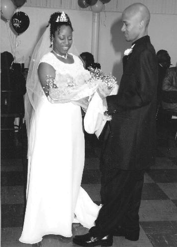 My wedding reception photo. - 1/29/2000, I presented my new bride with a dozen yellow roses to honor our friendship before our married. This is the black and white shot of that.